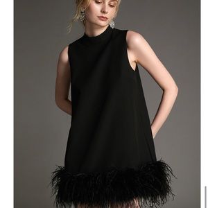 Black cocktail dress with feather!